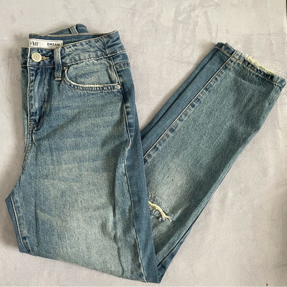 Light wash distressed denim jeans